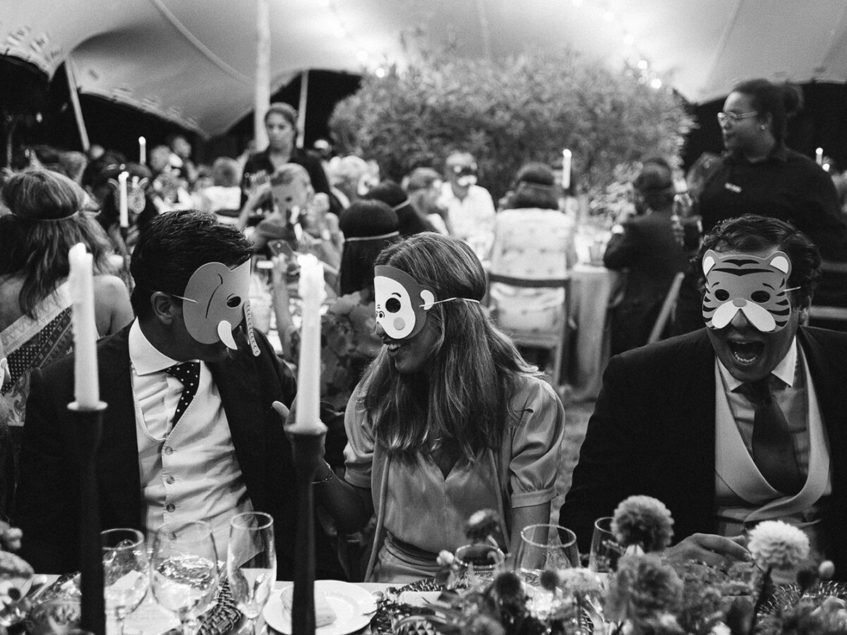 Guests with masks during dinner